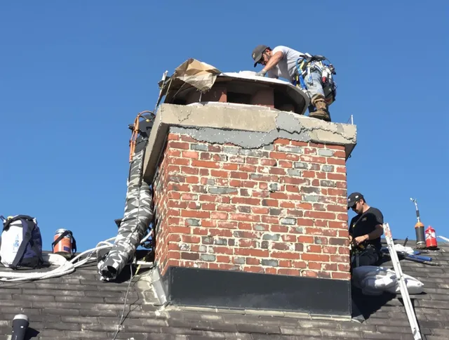 Clinton Chimney Sweep installing a custom chimney crown in Clinton, CT