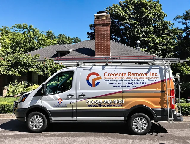 Clinton Chimney Sweep technician removing creosote safely in Clinton, CT