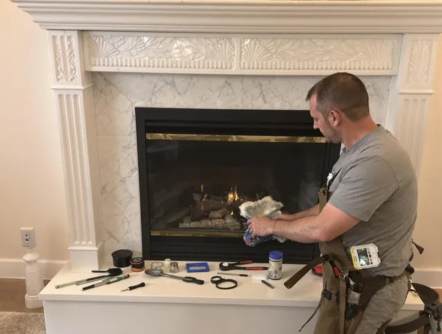 Clinton Chimney Sweep performing fireplace maintenance in Clinton, CT